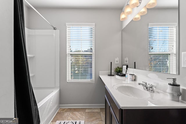 bathroom featuring vanity and shower / tub combo