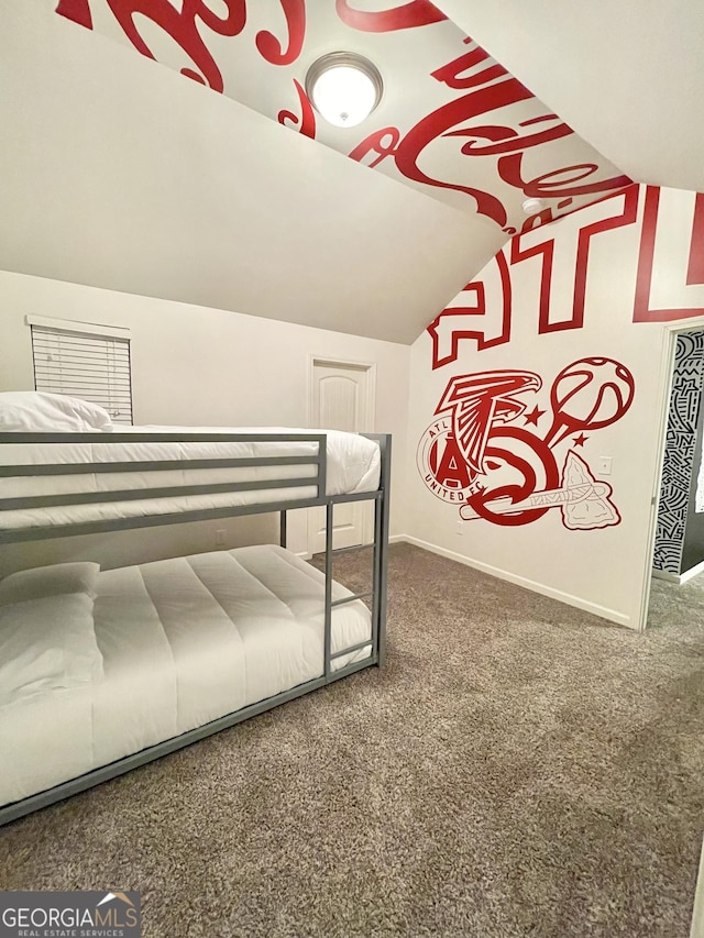 bedroom featuring carpet and lofted ceiling