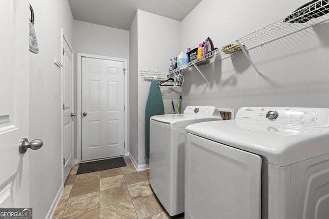 clothes washing area featuring washing machine and clothes dryer