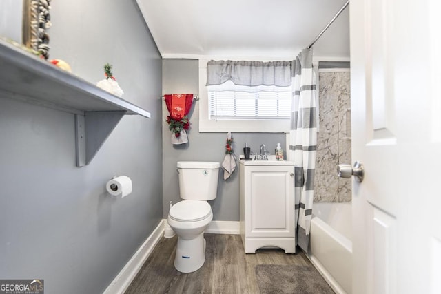 full bathroom featuring sink, hardwood / wood-style floors, shower / bath combination with curtain, and toilet