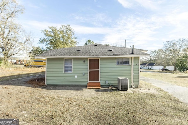 back of house with central AC