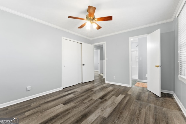 unfurnished bedroom featuring a closet, crown molding, ceiling fan, and dark wood-type flooring