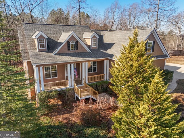 new england style home with a porch