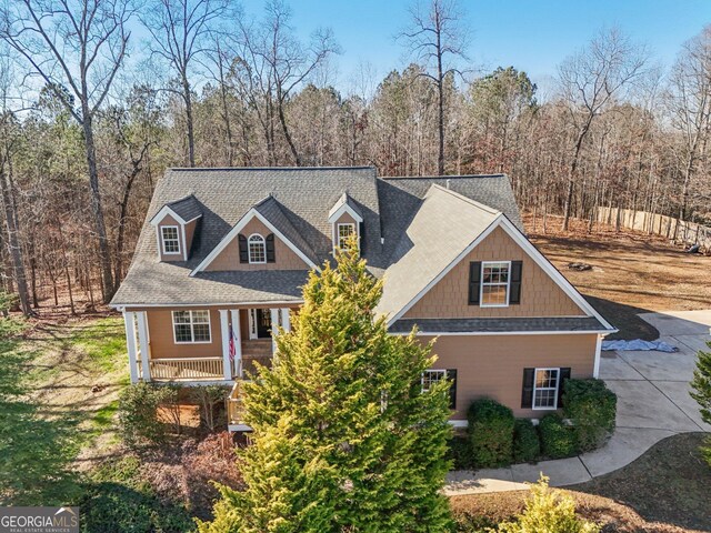 new england style home with a porch