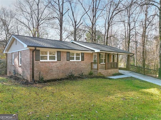 ranch-style house with a porch and a front lawn