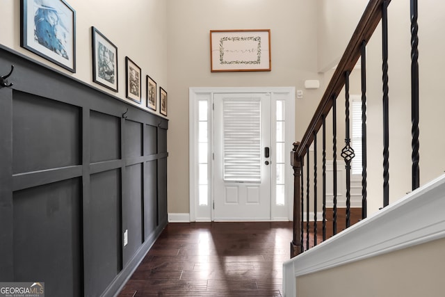 foyer entrance featuring dark hardwood / wood-style floors