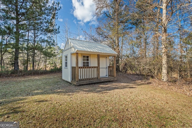 view of outbuilding with a lawn