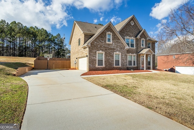 view of front of property with a front lawn and a garage