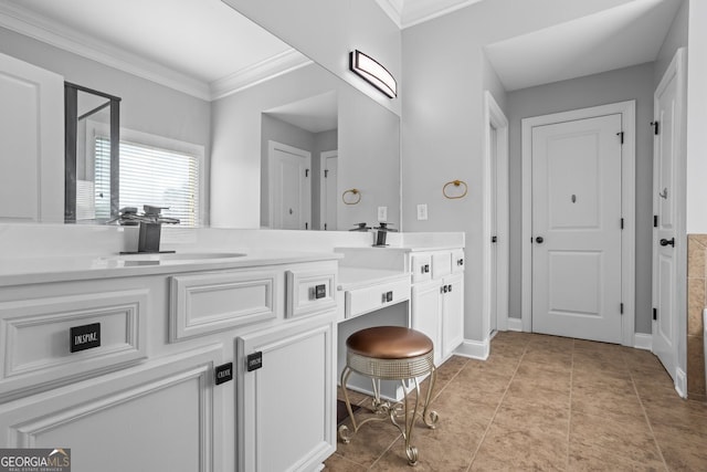 bathroom featuring vanity, tile patterned floors, and ornamental molding