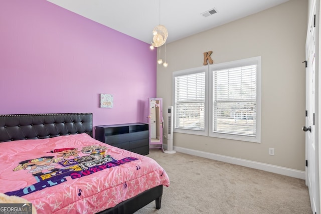 bedroom with light colored carpet