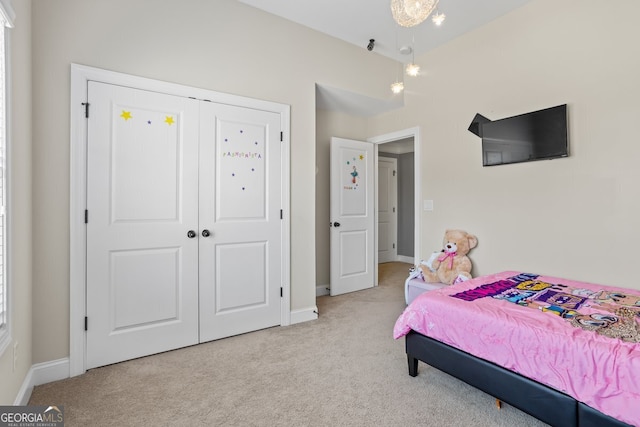 carpeted bedroom featuring a closet