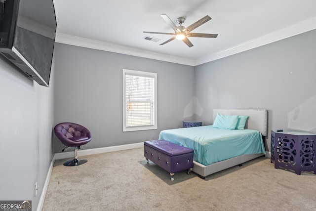 carpeted bedroom featuring ceiling fan and crown molding