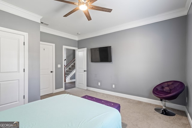 bedroom featuring light carpet, ceiling fan, and ornamental molding