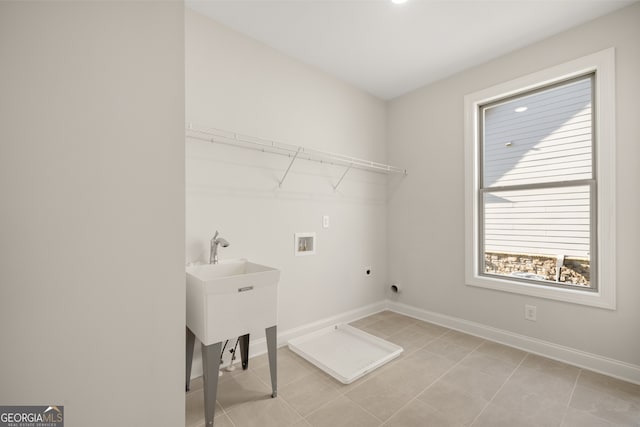 laundry room with light tile patterned flooring, washer hookup, and hookup for an electric dryer