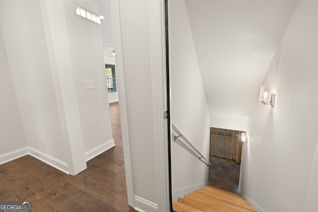 stairs featuring wood-type flooring