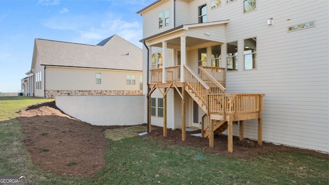 rear view of property with a yard