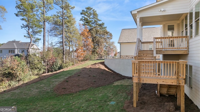 view of yard featuring a wooden deck