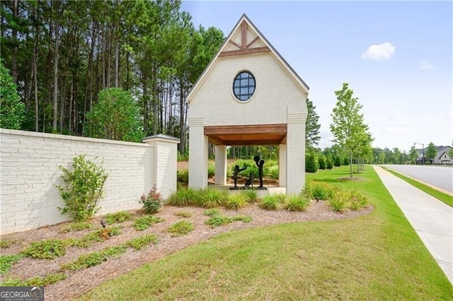 view of home's community with a lawn