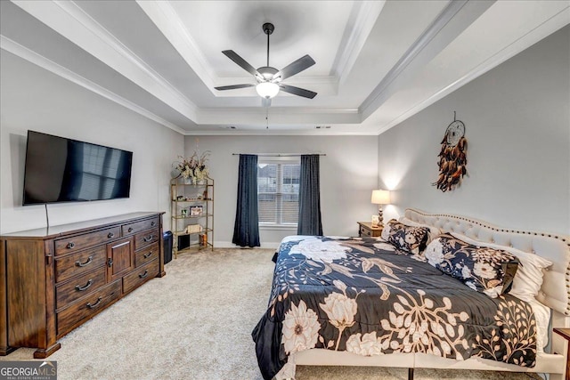 bedroom with carpet, ceiling fan, a raised ceiling, and crown molding