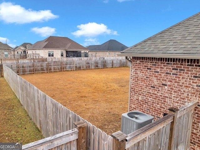 view of yard featuring central AC