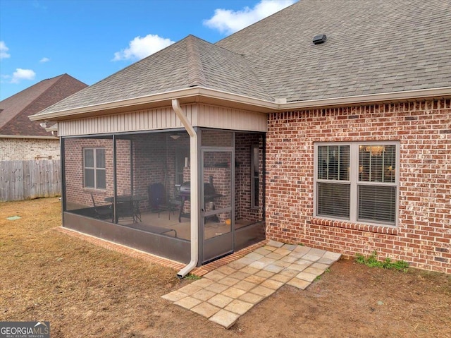 rear view of house with a sunroom