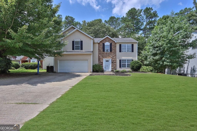 view of front of property featuring a garage and a front yard