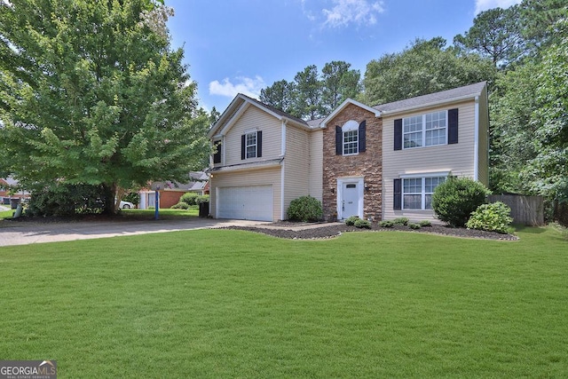 view of front of property with a garage and a front lawn