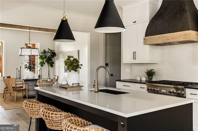 kitchen featuring a fireplace, a healthy amount of sunlight, and sink