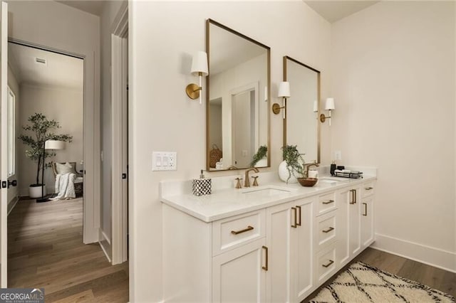 bathroom featuring wood-type flooring and vanity