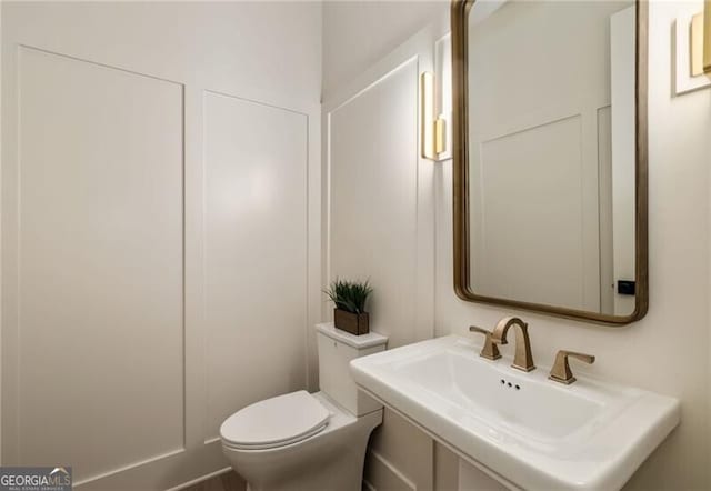 bathroom with sink and toilet