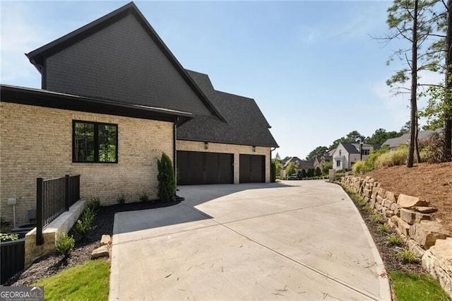 view of side of property with a garage