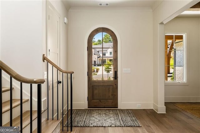 dining room featuring beam ceiling and hardwood / wood-style floors