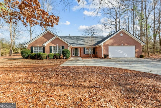 ranch-style home featuring a garage