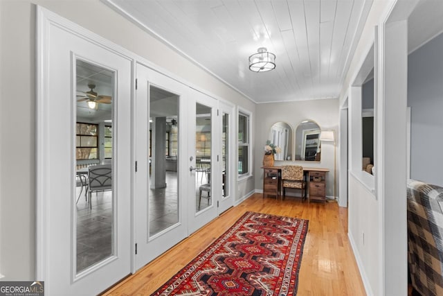 doorway to outside with wooden ceiling and wood finished floors