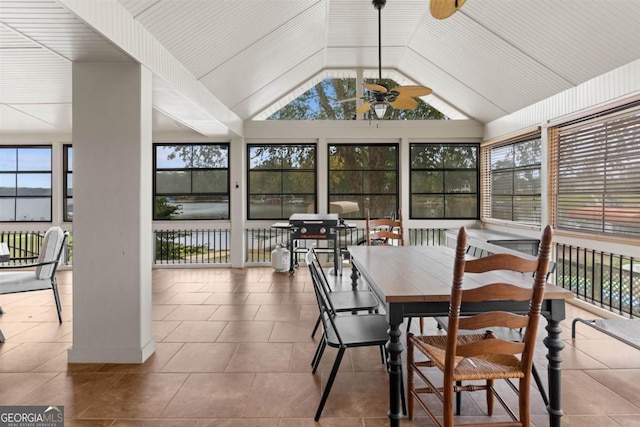 sunroom / solarium featuring ceiling fan and vaulted ceiling