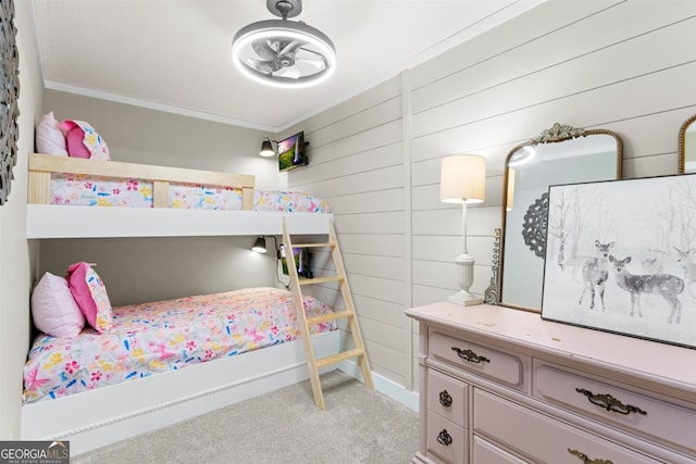 bedroom with crown molding and light colored carpet