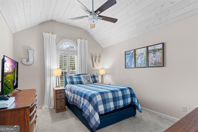 bedroom featuring wooden ceiling, light colored carpet, a ceiling fan, baseboards, and vaulted ceiling