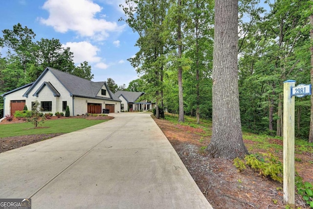 view of front of home featuring a front yard and a garage