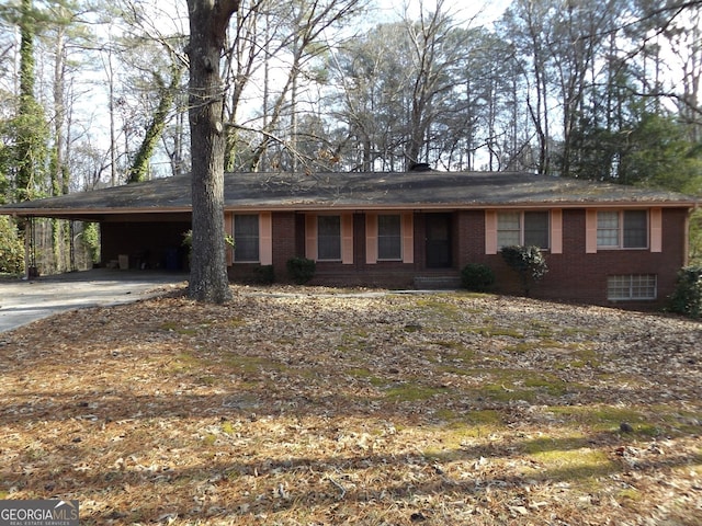 ranch-style house featuring a carport