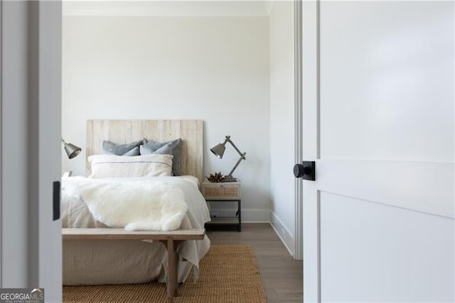 bedroom with wood-type flooring