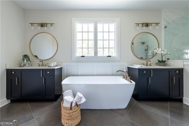 bathroom with tile patterned flooring, vanity, and independent shower and bath