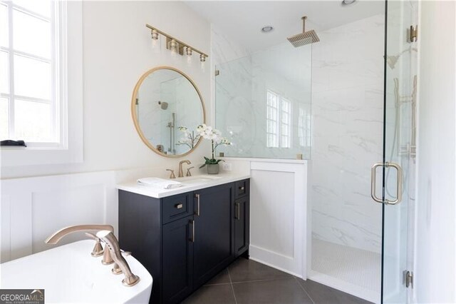 bathroom featuring tile patterned flooring, vanity, and an enclosed shower