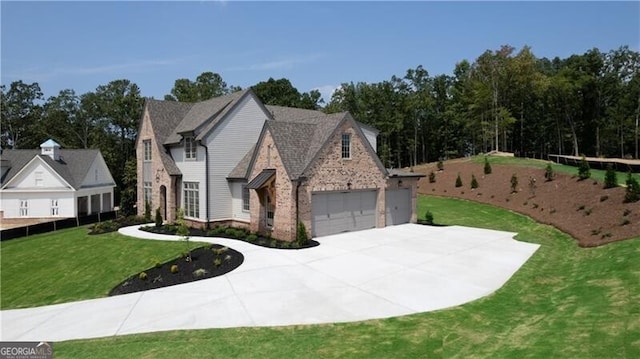 view of front facade with a garage and a front yard