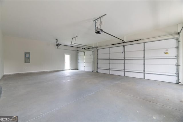 garage featuring electric panel and a garage door opener