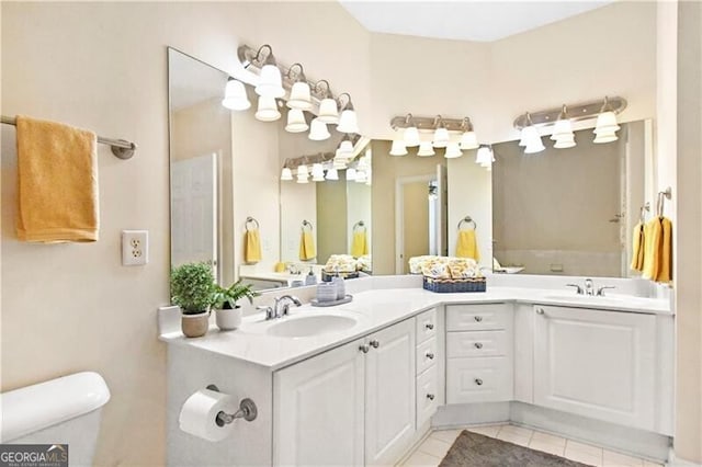 bathroom with tile patterned floors and vanity