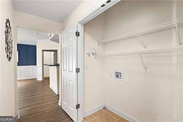 washroom with washer hookup and wood-type flooring