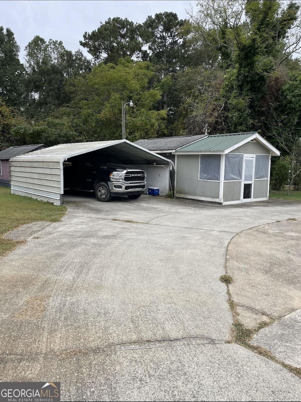 exterior space featuring a carport