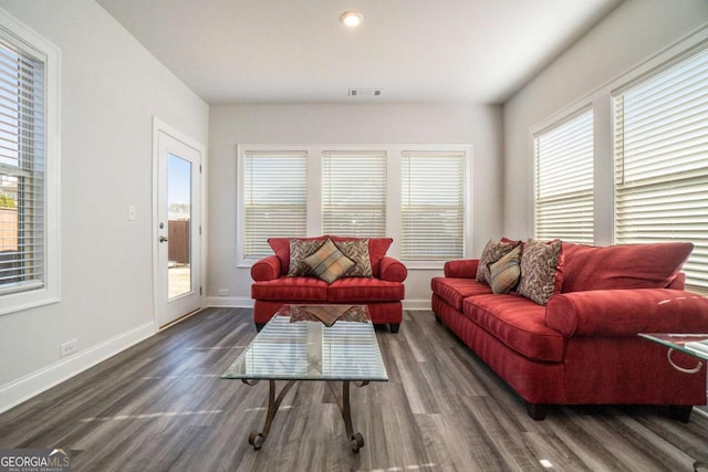 living room with dark hardwood / wood-style floors