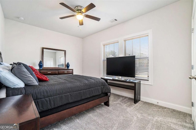 bedroom with ceiling fan and light colored carpet