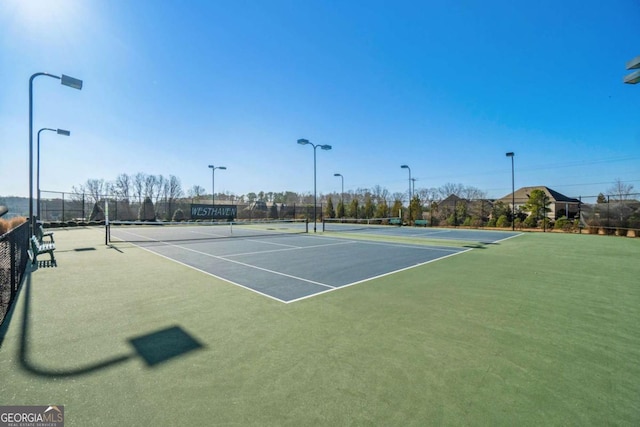 view of sport court with basketball hoop